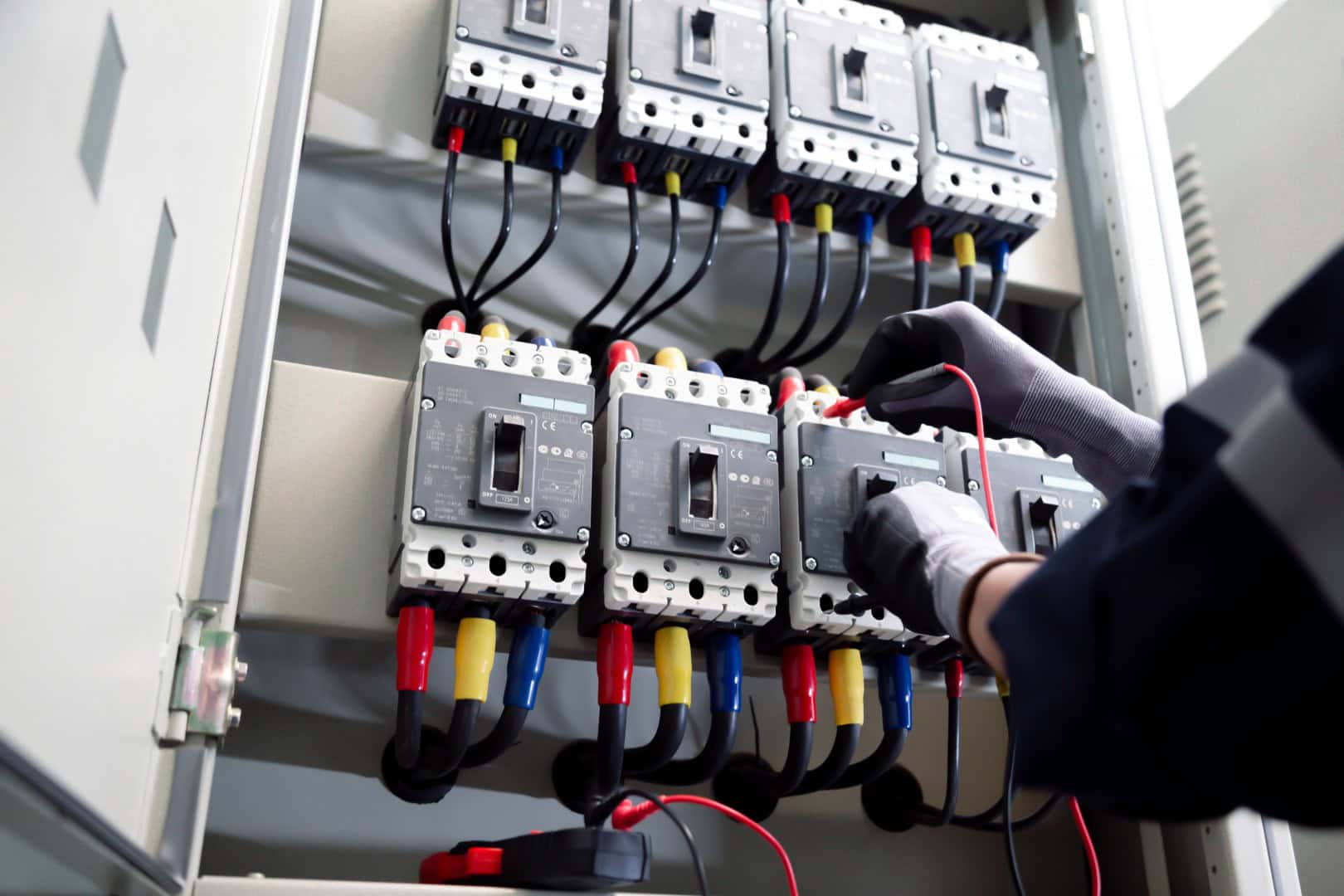 Professional electrician tests electrical installations. Measured with a multimeter to check accuracy.